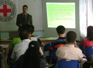 Dr. Jaff (standing) delivered a lecture in 2010 to a group of medical doctors and nurses in Iraq as part of a program to strengthen emergency services through training in communication and teamwork, infection control, waste management and other topics. (Contributed photo)