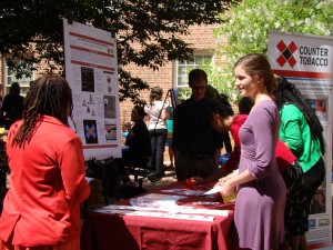 Students in spring 2013 display their capstone accomplishments at a poster exhibition.