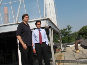 Dr. Ken Sexton (left) and Dr. Will Vizuete describe the operation of the smog chamber on top of McGavran-Greenberg Hall. (Photo by Linda Kastleman)