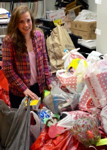 Zoey Frolking sorts through one of the many overflowing bags of Angel Tree gifts.