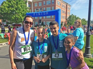 Dr. Itzel Vazquez-Vidal (left) is a postdoctoral research associate in the Voruganti Lab at the UNC NRI in Kannapolis. She is pictured with her running club partners after completion of the 'Jiggy with the Piggy' 5K on the N.C. Research Campus in May 2015.