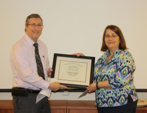 Christine Kantner receives an award from department chair Dr. Michael Kosorok.