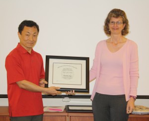 Kwanhye (Kwan) Jung smiles beside Dr. Sonia Davis, director of the CSCC.