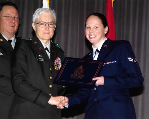 Marie Callahan (right) accepts a diploma at her Defense Language Institute graduation. (Contributed photo)