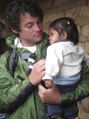Andrew holds a severely malnourished girl he met in rural Guatemala. To him, she represents completely unnecessary suffering that, for a low cost, can be eliminated.