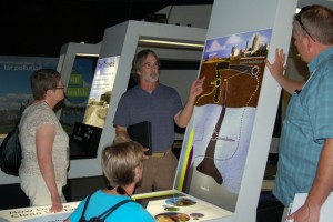 NC DENR staff Patrick Watters interacting with visitors to the coal tar exhibit at MPSC