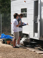 Photo by Gary Black - students interviewing hurricane victims about their needs