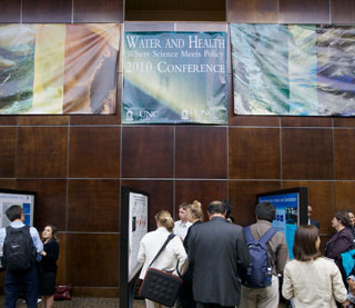 Participants in UNC's 2010 Water and Health conference attend a poster exhibit.