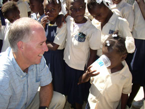 Dr. Greg Allgood visits with rural schoolchildren in Haiti in 2006.