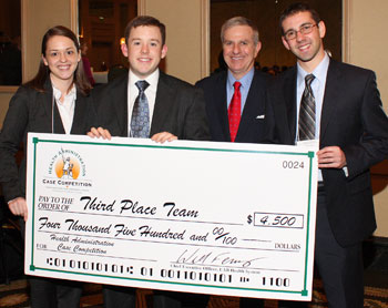 (L-R) Emily Stallings, Andy Wilkinson, UAB presenter and Nathan Barbo pose during the case competition award ceremony.