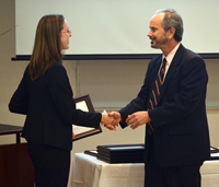Paige Coulter is congratulated by Director of the HPM Residential Master's Program, Bruce Fried, PhD