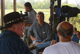 Associate producer Jim Sander interviews former hog farmer Don Webb (left) and environmental hero Gary Grant on Grant's porch in Tillery, N.C.