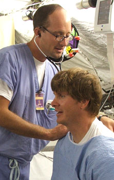 Dr. Richard Vinroot tends to a patient