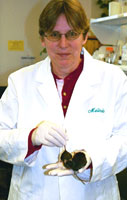 Dr. Melinda Beck with research mouse