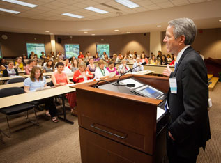 Dr. Herbert Peterson addresses a group of maternal and child health alumni and friends at the 2012 Foard Lecture.