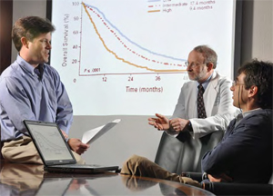 Dr. William Carpenter (left) discusses research data with Dr. Richard Goldberg (center) and Dr. Til Stürmer, associate professor of epidemiology at the UNC Gillings School of Global Public Health.