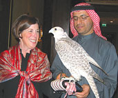 Dean Barbara K. Rimer is introduced to a falcon by her host, H.E. Majid Al Mansouri, Secretary General of the Environment Agency-Abu Dhabi.