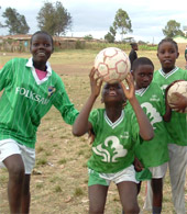 Group of kids from Kibera playing soccer