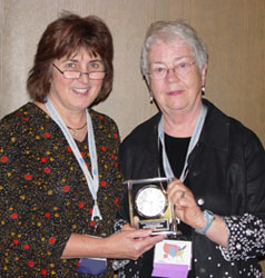Rachel Stevens, right, receives the NALBOH President's Award.