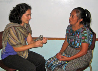 Sunderland-Perez (left) talks with a woman at Pueblo a Pueblo in Guatemala. Photo courtesy of the UNC School of Social Work.
