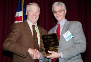 Dr. Mike Aitken (right) presents the Greenberg Award to Dr. Jim Swenberg.