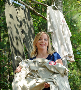 Meagan Vaughn displays clothing worn by outdoor workers in a research study on prevention of tick bites. The clothing is impregnated with a long-lasting repellent and insecticide. Photo by Dan Sears.