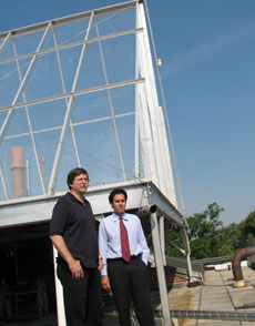 Drs. Ken Sexton and Will Vizuete (l-r) describe the operation of the smog chamber on top of UNC's McGavran-Greenberg Hall.