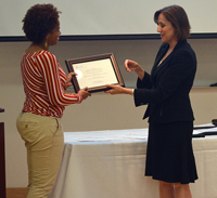Stephanie Watson-Grant is presented with her award by Suzanne Havala-Hobbs DrPH, Director of the Executive Doctoral Program
