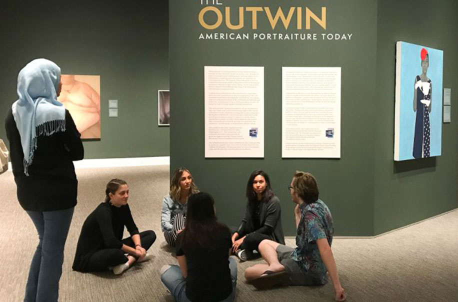 Health Behavior students talk together at the Ackland Art Museum.