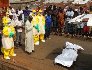 A local man oversees a funeral for an Ebola victim in Sierra Leone. (Photo by Richard Brostrom)
