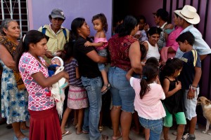 Women and children wait to be seen at at clinic in Honduras