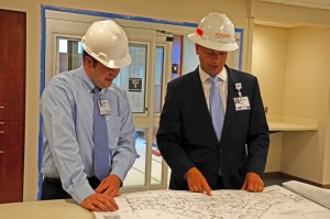Coble (left) reviews blueprints with Chris Hutter, Novant health's senior director of operations.