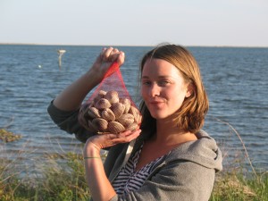 Anna Child shows off fresh clams that will be sold through Core Sound Seafood. (Contributed photo)