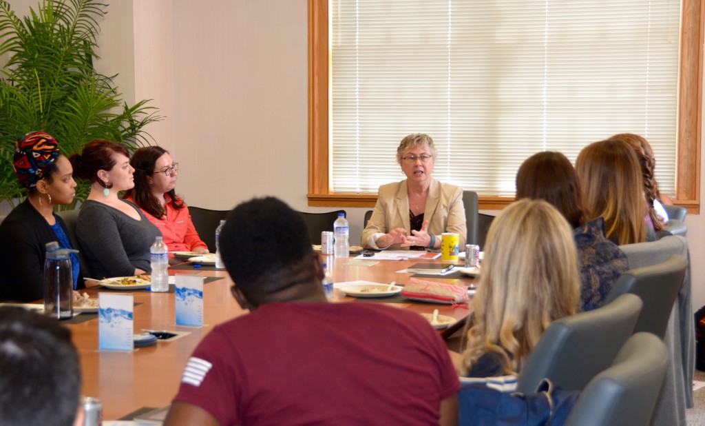 Dr. Carol Hamilton (center) speaks with students at the inaugural GlobaLocal Lunch.