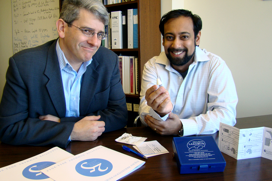 Former epidemiology PhD candidate Nab Dasgupta shows his overdose prevention kit to advisor and professor of epidemiology Steve Marshall.