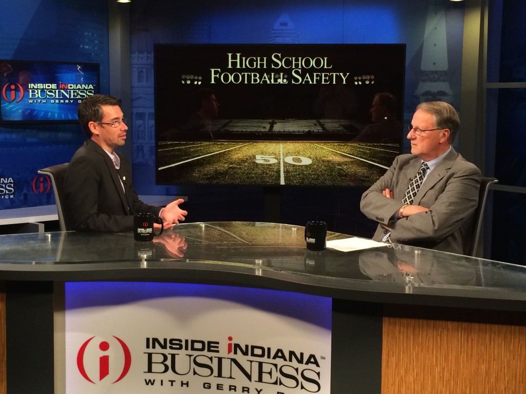 Dr. Zachary Kerr (left) discusses football injuries with host Bill Benner on Inside INdiana Business Televison. (Contributed photo)