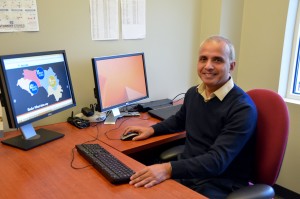 Manish Kumar works in his MEASURE Evaluation office in Chapel Hill, N.C. (Photo by Jennie Saia)