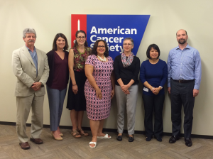The ACS Evidence in Action training team stands in front of American Cancer Society sign.