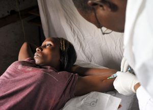 A woman in Nairobi, Kenya undergoes a procedure to insert an implant that provides birth control for up to five years. 
