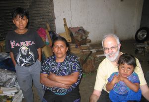 Dr. Barry Popkin visits with a family in their home in Chiapas, Mexico.