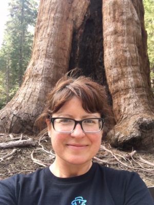 Heather snaps a selfie in front of one of the giant trees in Sequoia National Park.