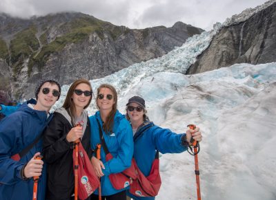 Jane pauses with her three children during a hike on the Franz Josef Glacier in New Zealand.