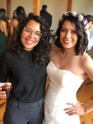 Karla (left) hugs her friend Nadia Pacheco, who married Karla's health behavior classmate.