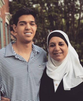 Amro smiles with his mother.