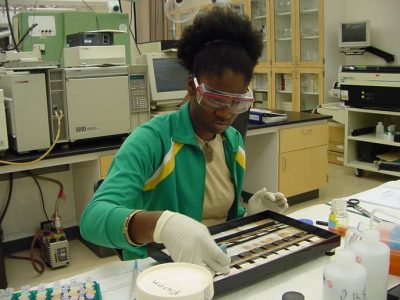 Alumna Courtney Woods — now a faculty member at the Gillings School — works in the lab.