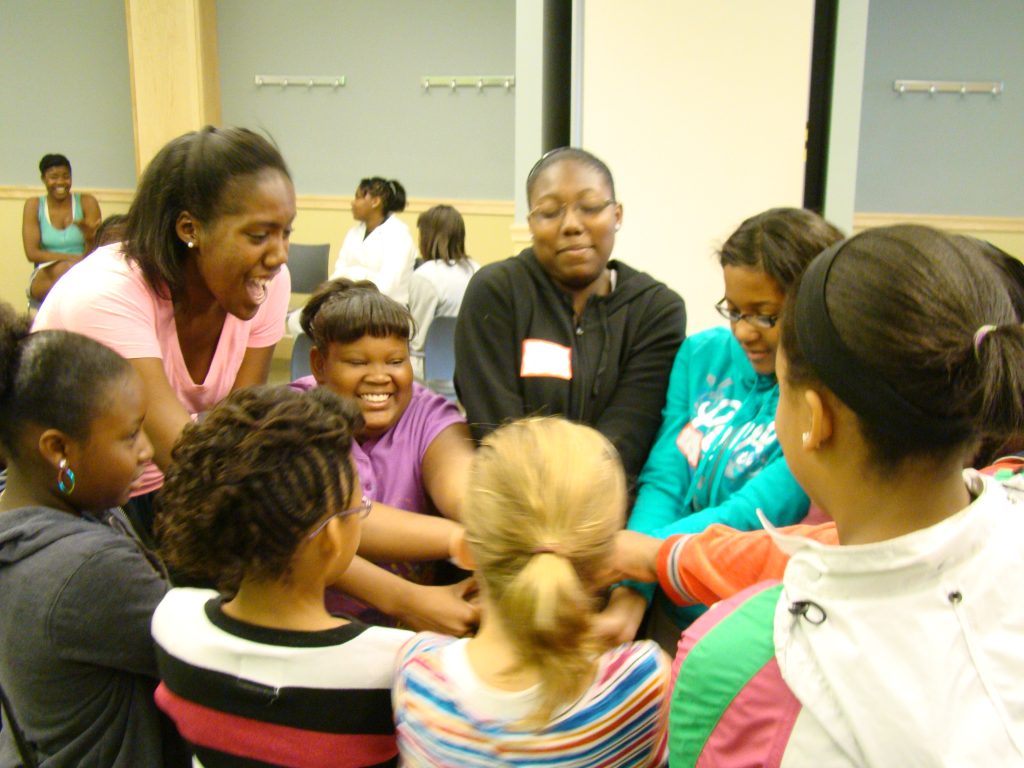 Camille McGirt (at left, in pink) leads a "Healthy Girls" workshop while an undergraduate at UNC. (Photo by Linda Kastleman)