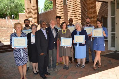 The 2016-2018 cohort of Thorpe Engaged Faculty Scholars smiles together following their graduation ceremony. (Dr. Lightfoot is wearing a yellow necklace.)