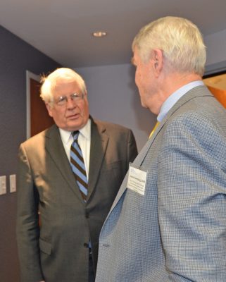 Congressman David E. Price (left) speaks with Dr. Swenberg in 2014.