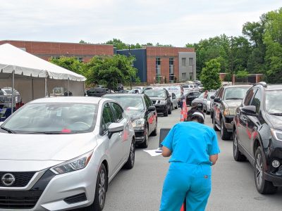 Cars line up for drive-through COVID-19 testing
