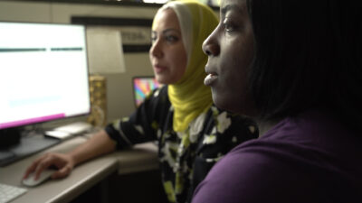 Monisa Aijaz (left) and Heather Wire (right) work on a project.